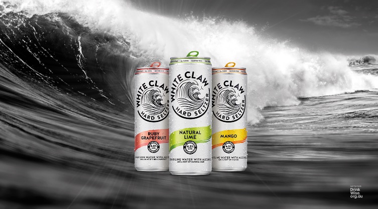 White claw cans over ocean wave