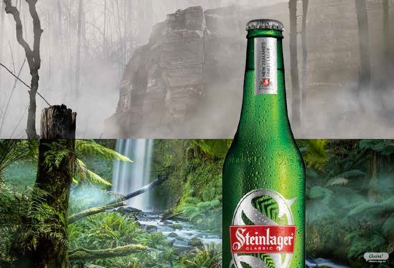 Steinlager carbon zero - beer in front of rainforest, half destroyed half preserved